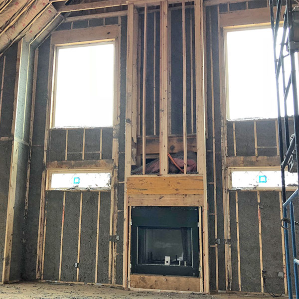Exterior Wall Cellulose Insulation around Fireplace