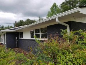 Replacement gutters on the front of a home.